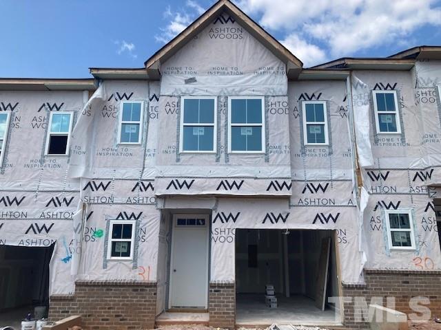 a front view of a building with glass windows