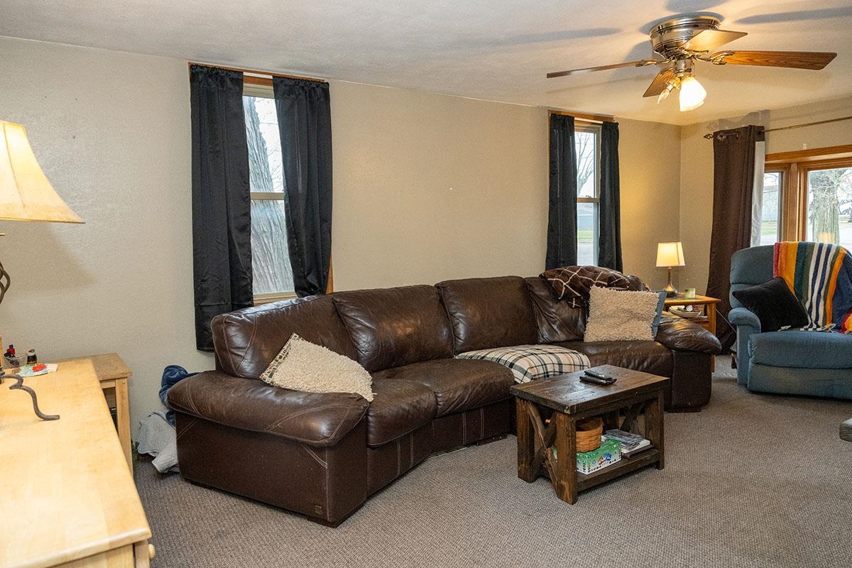 503 West 2nd Street Byron, IL 61010 - Photo 15 of 56 a living room with furniture and a chandelier