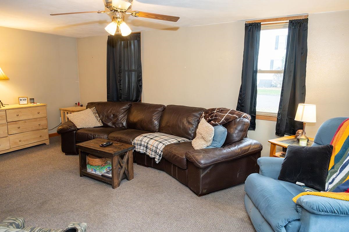 503 West 2nd Street Byron, IL 61010 - Photo 16 of 56 a living room with furniture and a large window