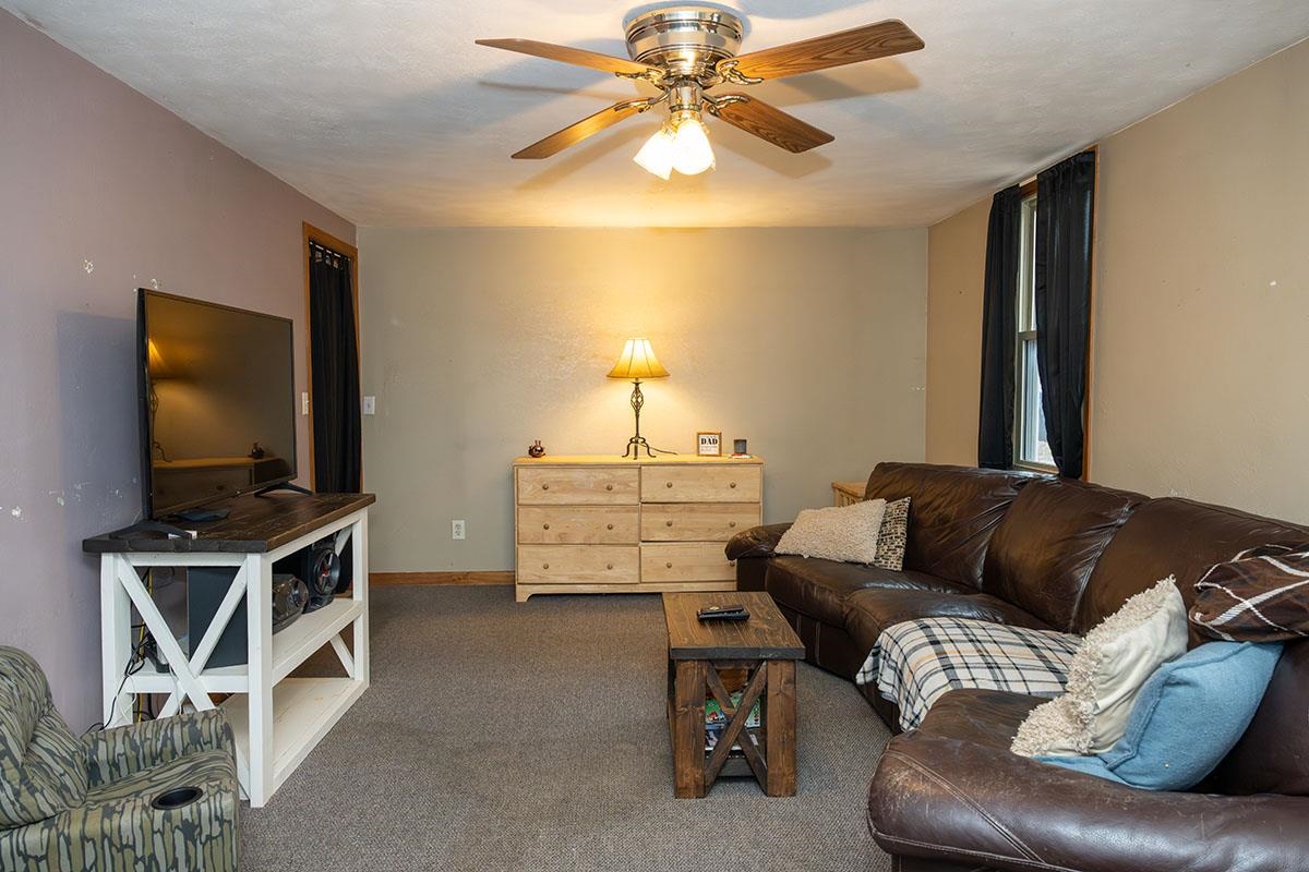 503 West 2nd Street Byron, IL 61010 - Photo 17 of 56 a living room with furniture and a flat screen tv