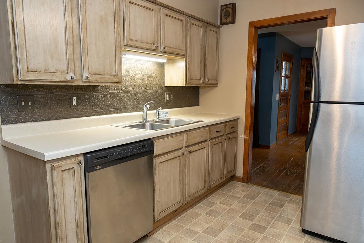 503 West 2nd Street Byron, IL 61010 - Photo 21 of 56 a kitchen with stainless steel appliances granite countertop a sink stove and refrigerator
