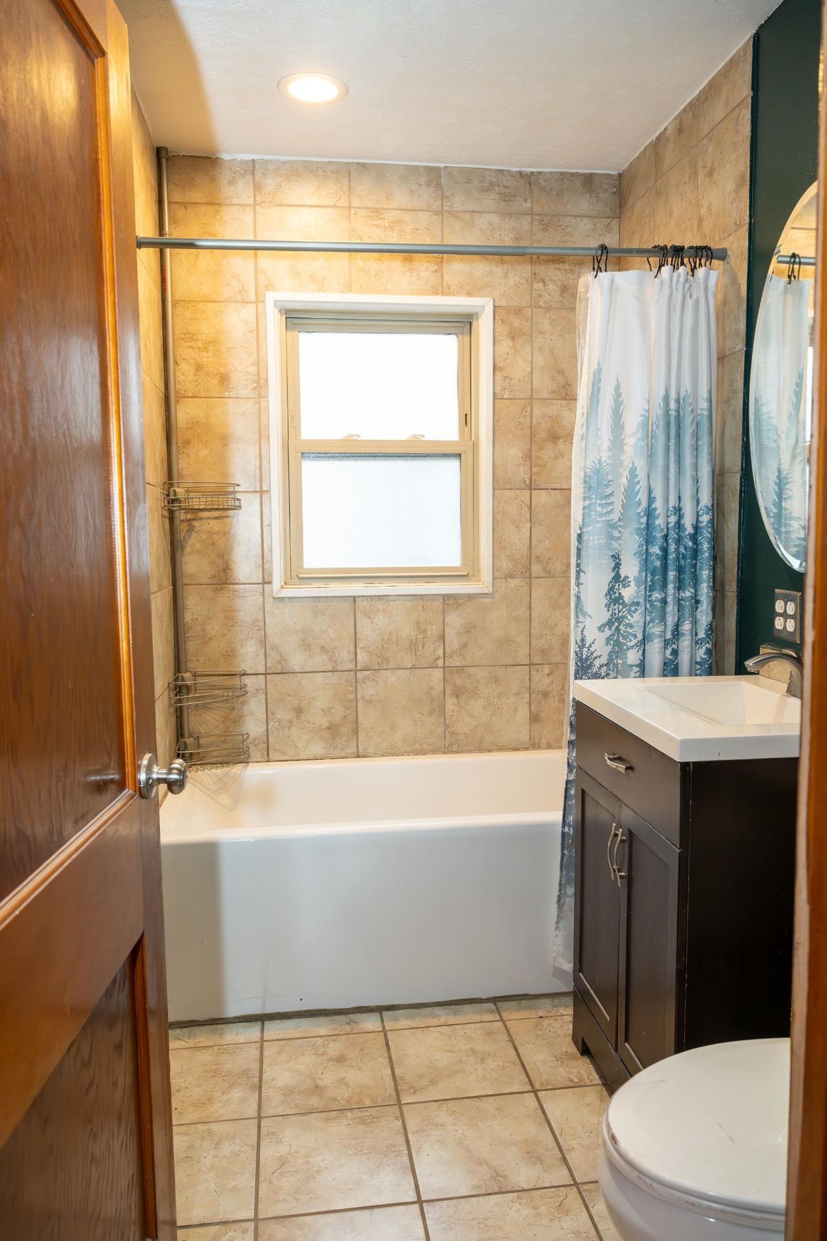 503 West 2nd Street Byron, IL 61010 - Photo 25 of 56 a bathroom with a bathtub a sink and a shower