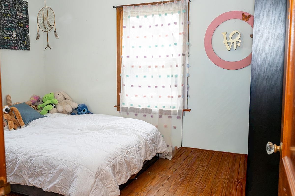 503 West 2nd Street Byron, IL 61010 - Photo 28 of 56 a bedroom with a bed and a window