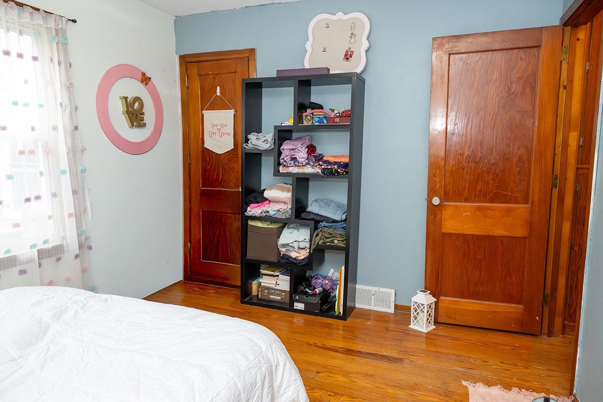 503 West 2nd Street Byron, IL 61010 - Photo 29 of 56 a bed room with a bed and a mirror
