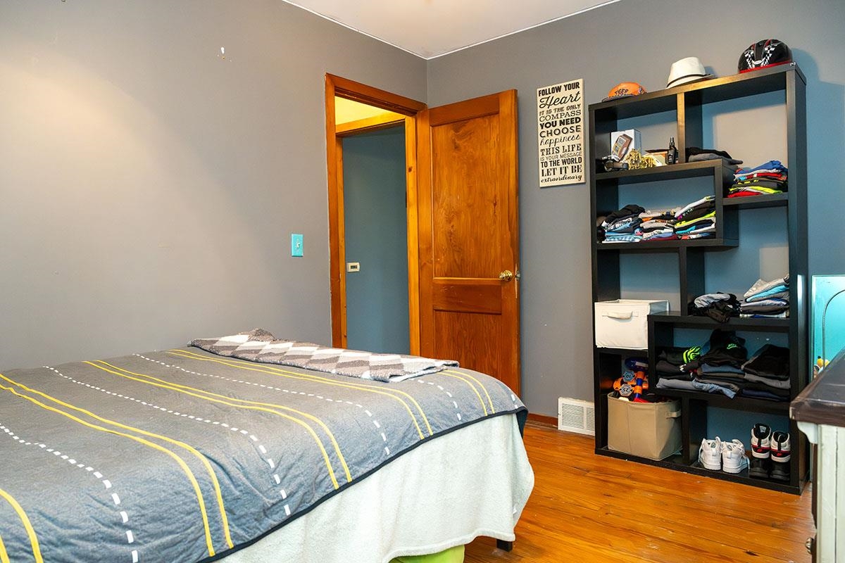 503 West 2nd Street Byron, IL 61010 - Photo 31 of 56 a bedroom with a bed and a tv