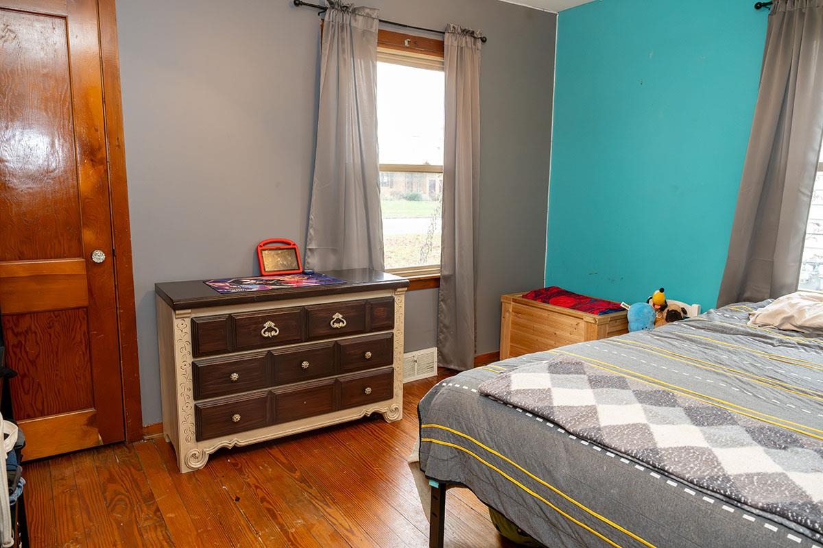 503 West 2nd Street Byron, IL 61010 - Photo 32 of 56 a bedroom with a bed and a dresser