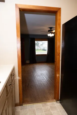 a view of room with window and wooden floor