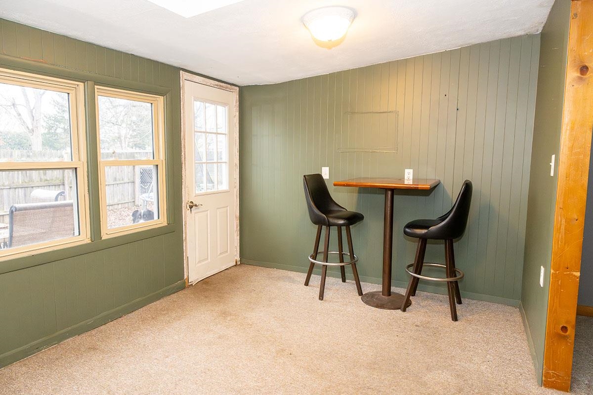 503 West 2nd Street Byron, IL 61010 - Photo 38 of 56 a view of a workspace with furniture and a window