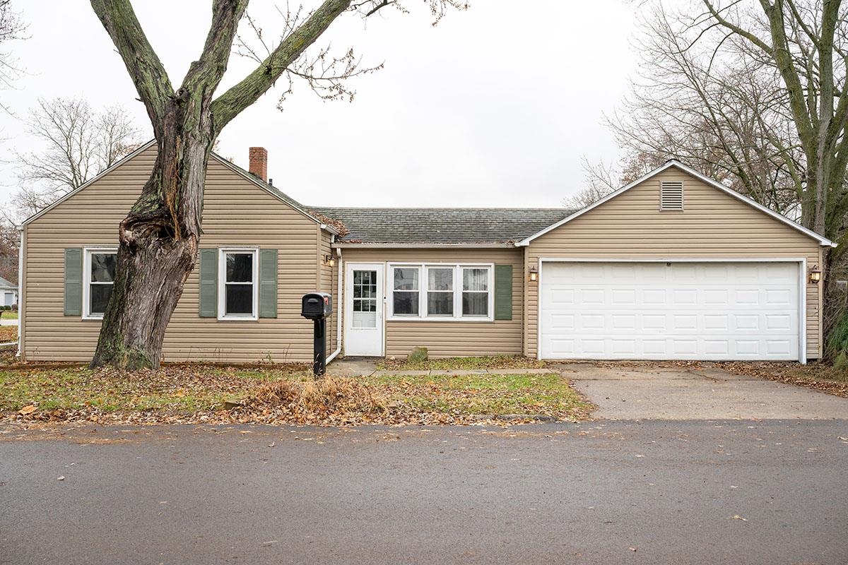 503 West 2nd Street Byron, IL 61010 - Photo 5 of 56 a front view of a house with a yard and garage