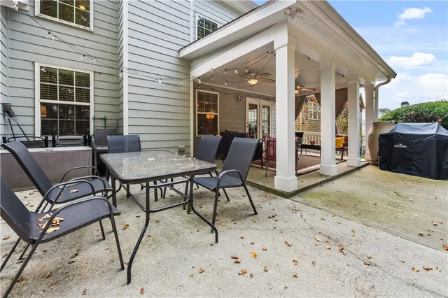 a outdoor space with a couch and chairs