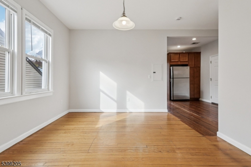 507 Bloomfield Avenue Nutley, NJ 07110 - Photo 11 of 26 a view of an empty room with window and wooden floor