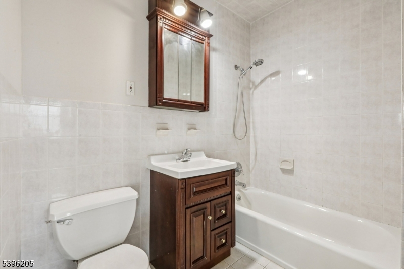 507 Bloomfield Avenue Nutley, NJ 07110 - Photo 18 of 26 a bathroom with a sink toilet vanity and bathtub