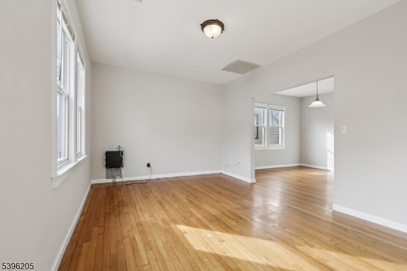 507 Bloomfield Avenue Nutley, NJ 07110 - Photo 4 of 26 a view of empty room with wooden floor and fan