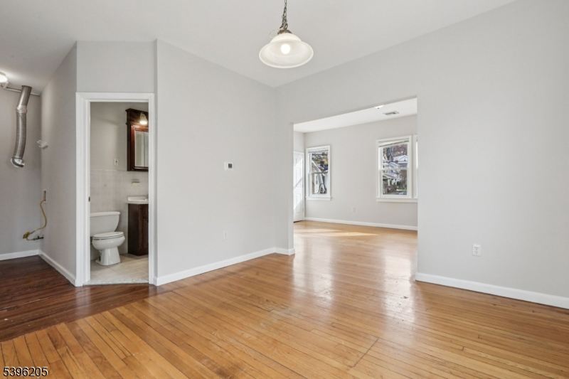 507 Bloomfield Avenue Nutley, NJ 07110 - Photo 9 of 26 wooden floor in an empty room with a window