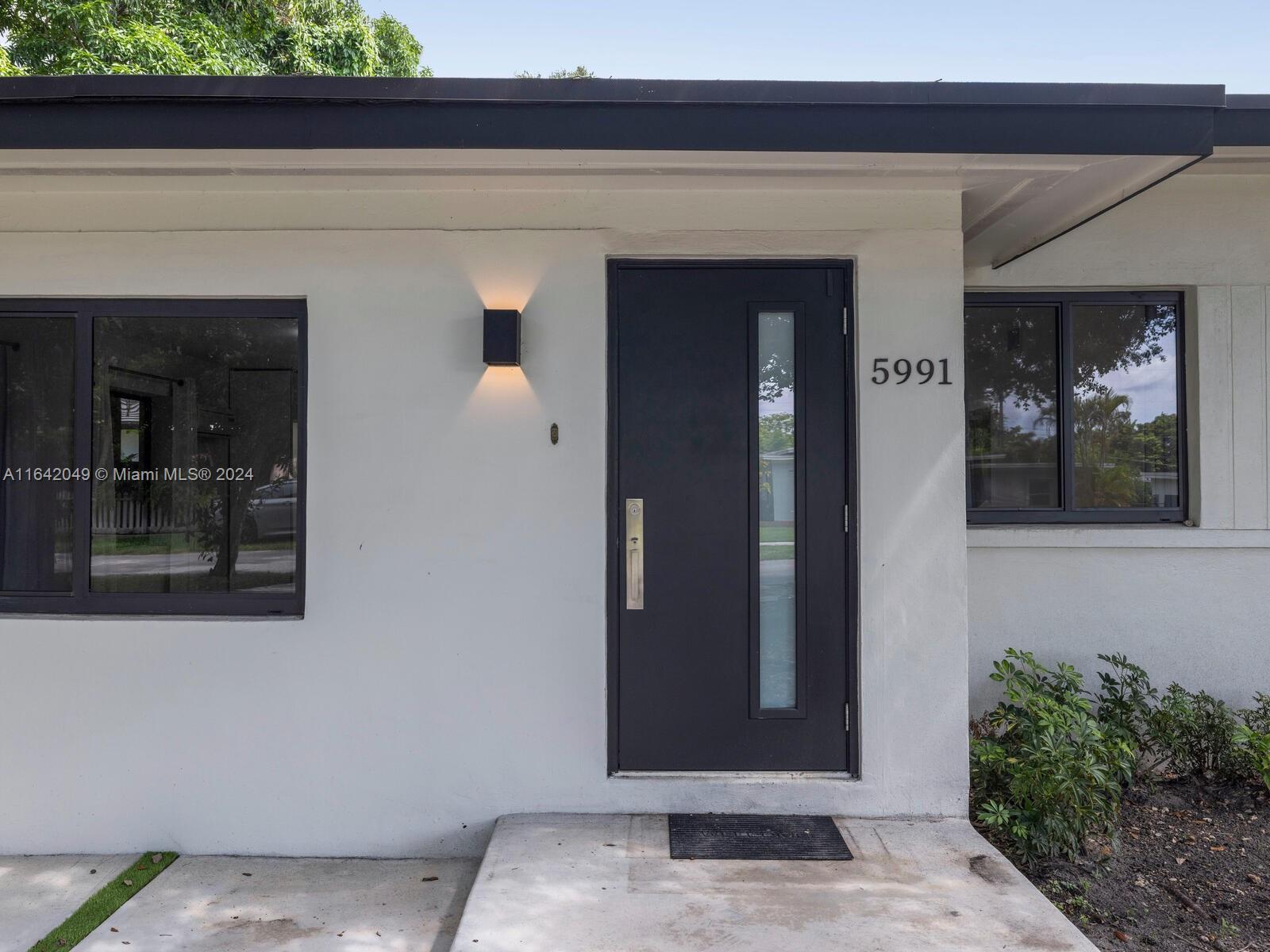 5991 Southwest 45th Street Miami, FL 33155 - Photo 2 of 35 a view of entrance