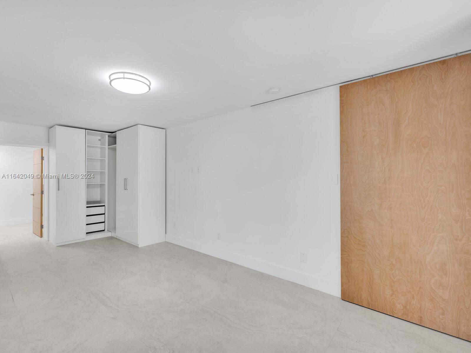 5991 Southwest 45th Street Miami, FL 33155 - Photo 22 of 35 a view of empty room with ceiling fan