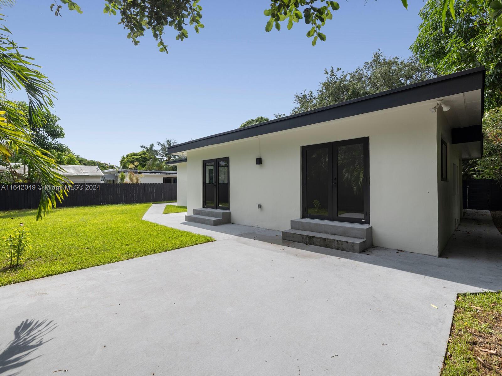 5991 Southwest 45th Street Miami, FL 33155 - Photo 31 of 35 a view of an house with backyard and garden