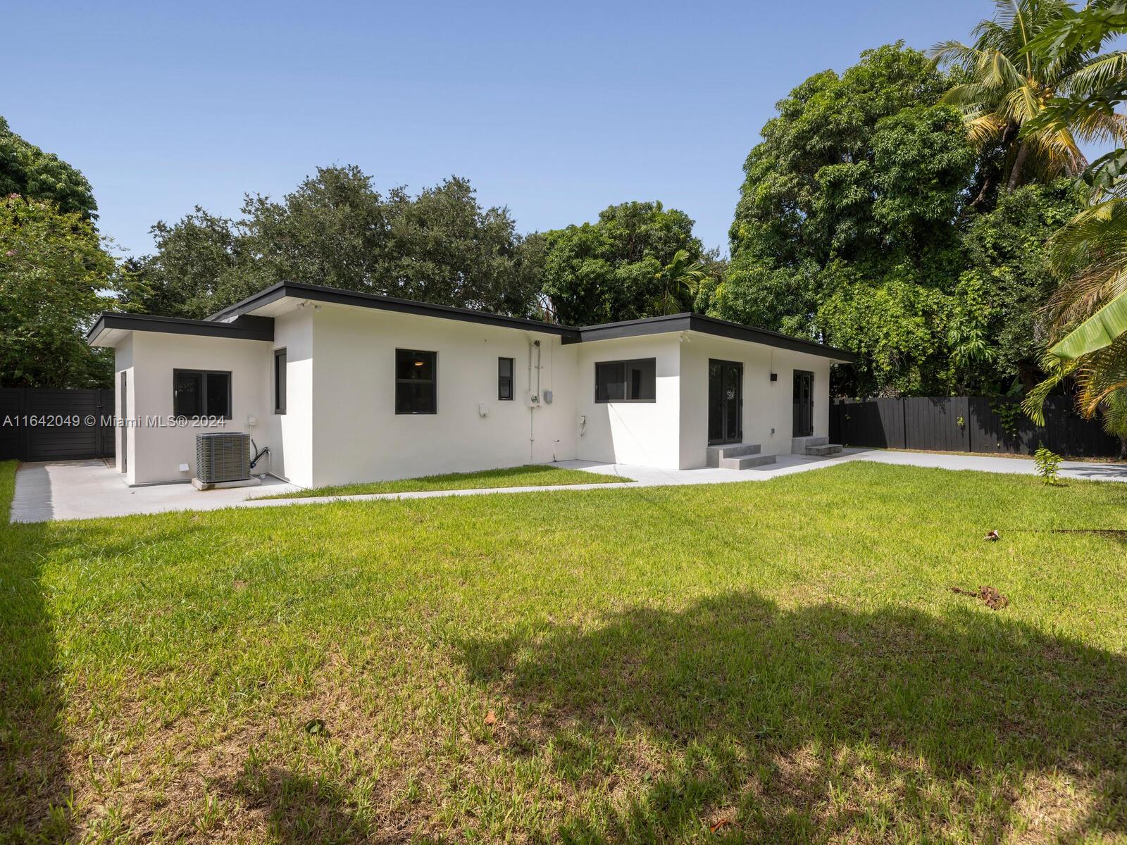 5991 Southwest 45th Street Miami, FL 33155 - Photo 32 of 35 a view of a yard with a house