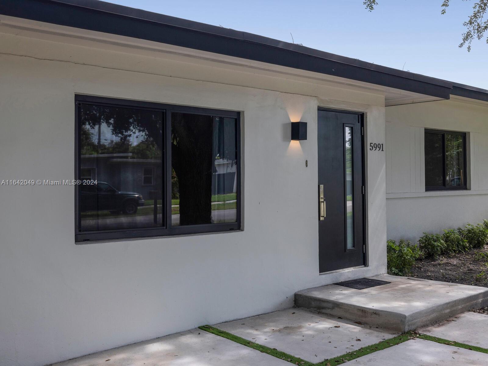 5991 Southwest 45th Street Miami, FL 33155 - Photo 5 of 35 a view of an entrance of the house