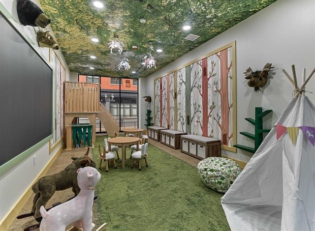 260 Ave East, Unit 609 Bayonne, NJ 07002 - Photo 16 of 24 a balcony with furniture and potted plants