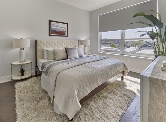 260 Ave East, Unit 609 Bayonne, NJ 07002 - Photo 4 of 24 a bedroom with a bed and a window