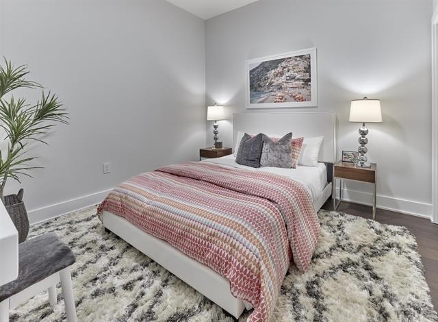 260 Ave East, Unit 609 Bayonne, NJ 07002 - Photo 6 of 24 a bedroom with bed and a potted plant