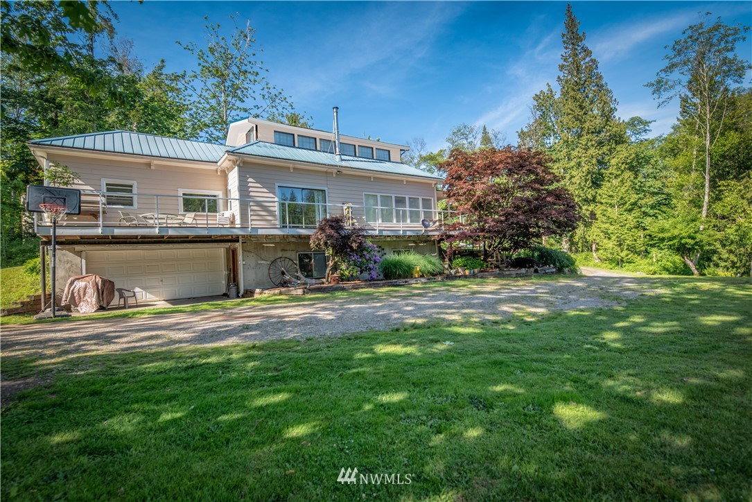 3635 H Street Road Blaine, WA 98230 - Photo 2 of 16 a view of a house with a yard