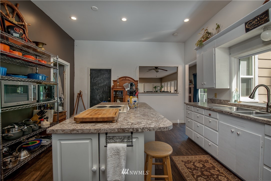 3635 H Street Road Blaine, WA 98230 - Photo 6 of 16 a kitchen with stainless steel appliances granite countertop a stove a sink and a refrigerator