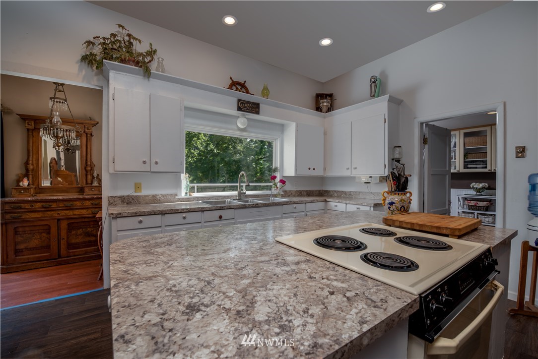 3635 H Street Road Blaine, WA 98230 - Photo 7 of 16 a kitchen with a stove and a sink