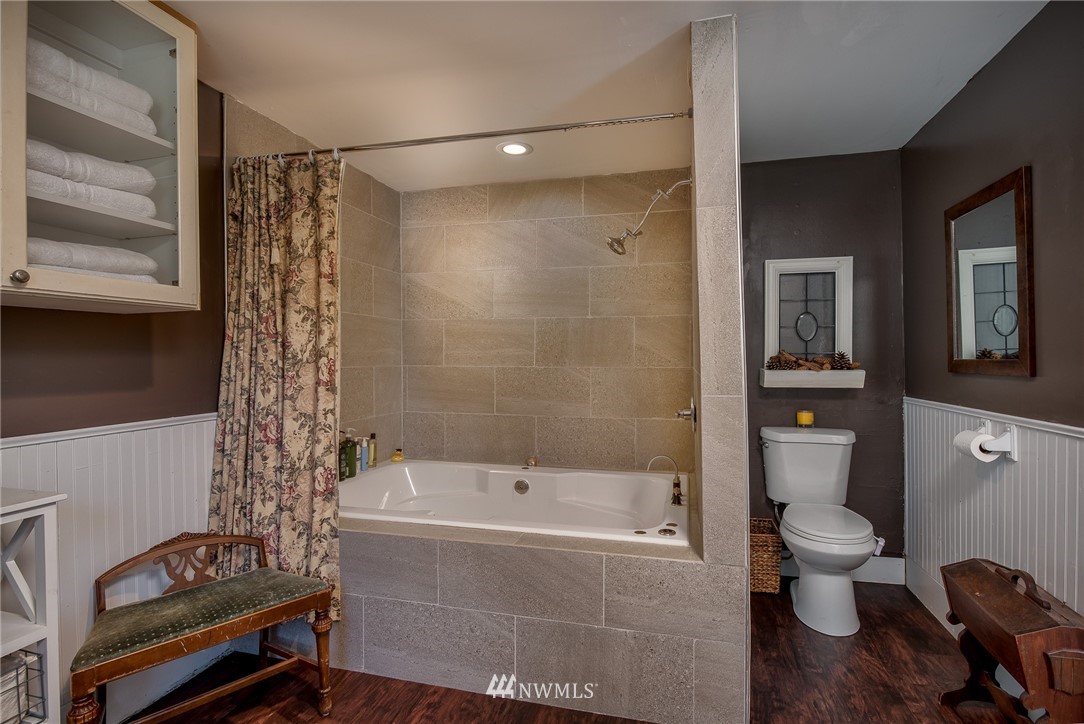 3635 H Street Road Blaine, WA 98230 - Photo 9 of 16 a bathroom with a bathtub and a shower