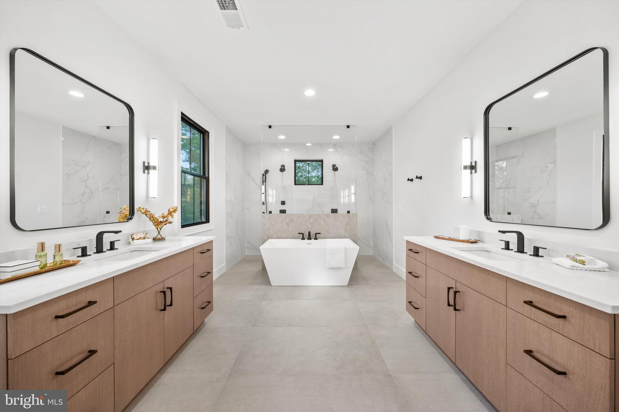 6807 29th Street North Arlington, VA 22213 - Photo 25 of 36 a bathroom with a double vanity sink mirror double and bathtub