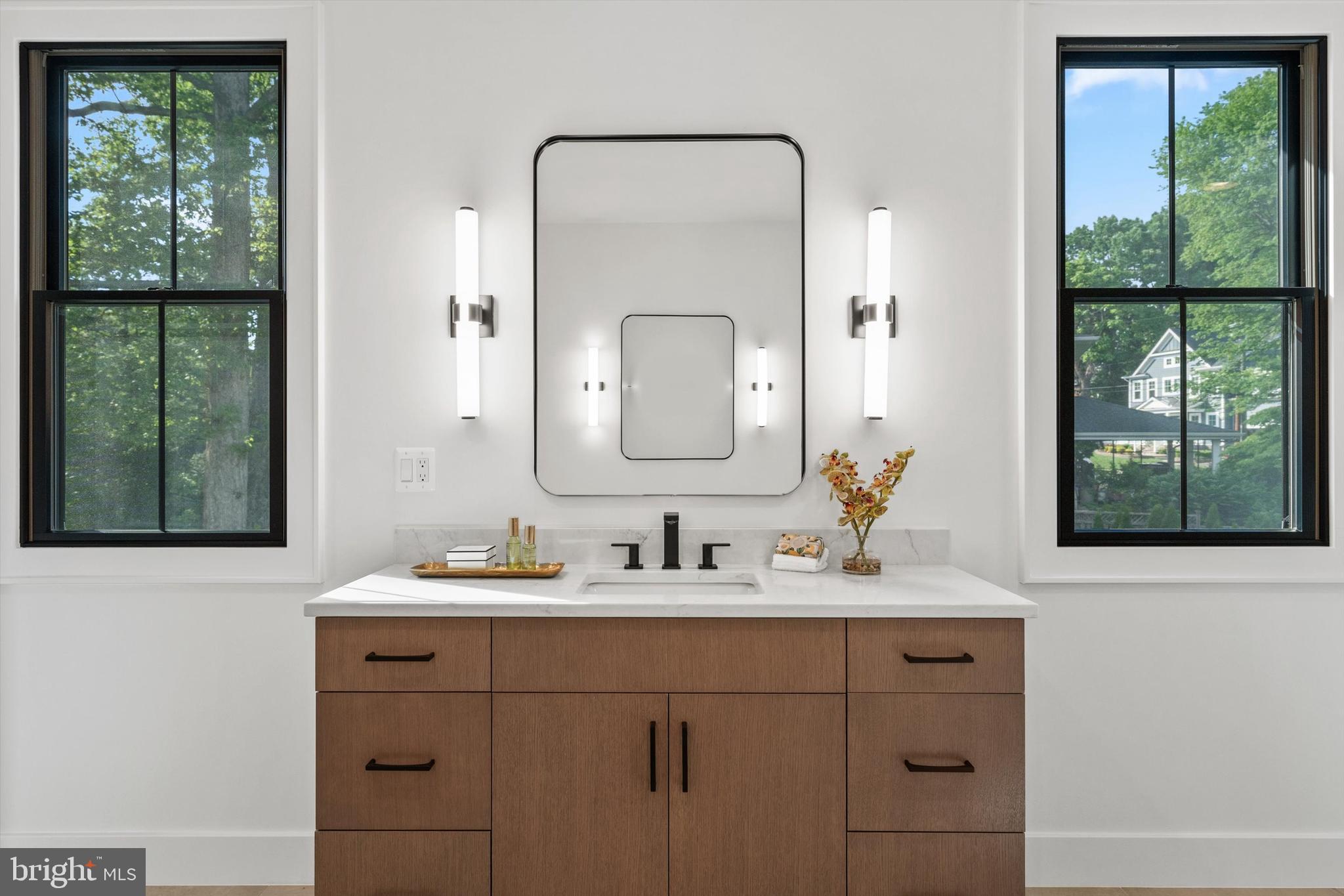 6807 29th Street North Arlington, VA 22213 - Photo 26 of 36 a bathroom with a double vanity sink mirror and a window