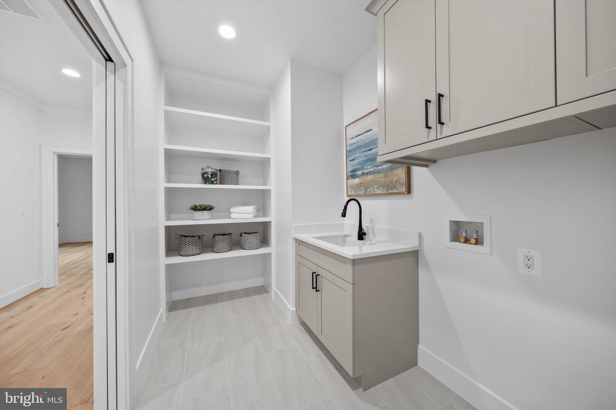 6807 29th Street North Arlington, VA 22213 - Photo 27 of 36 a view of a kitchen with white cabinets