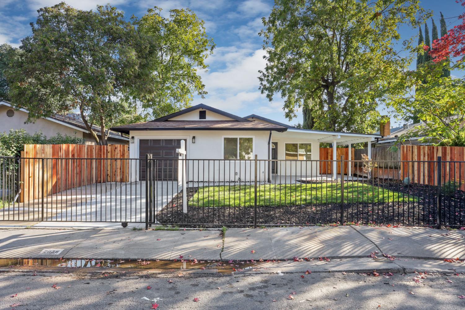 2036 Del Rio Drive Stockton, CA 95204 - Photo 2 of 30 a view of a house with a garden and plants