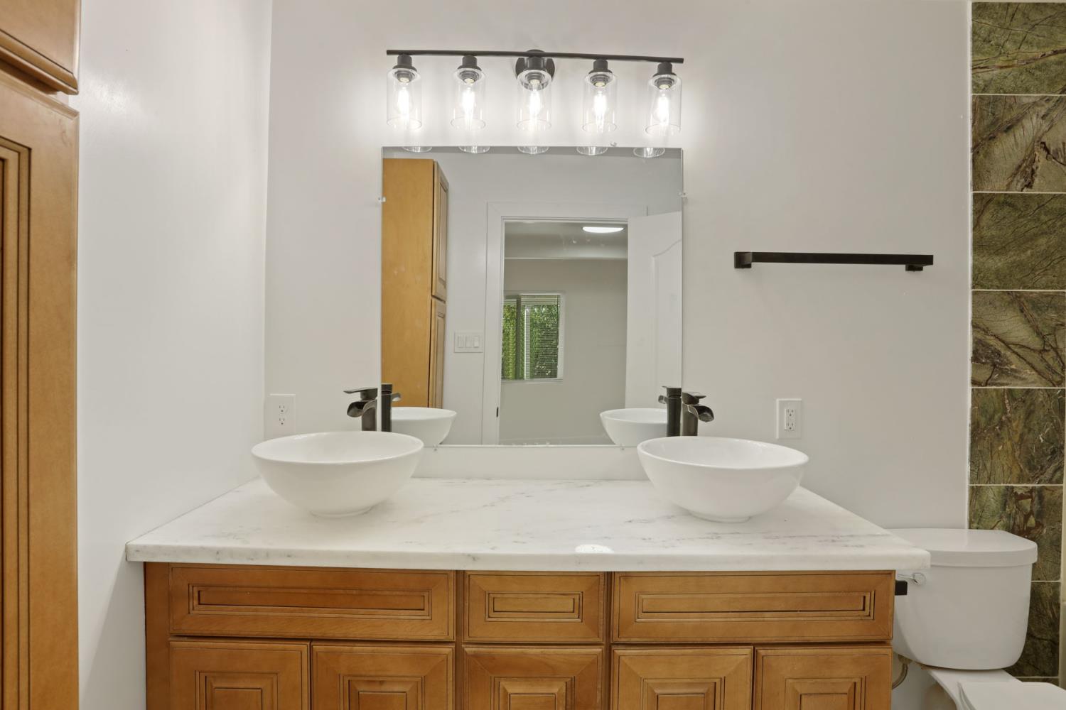 2036 Del Rio Drive Stockton, CA 95204 - Photo 26 of 30 a bathroom with a sink and a mirror