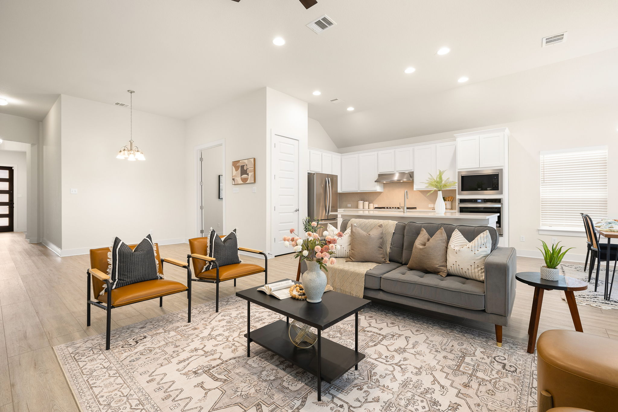 20904 Carries Ranch Road Pflugerville, TX 78660 - Photo 11 of 33 a living room with furniture kitchen view and a table