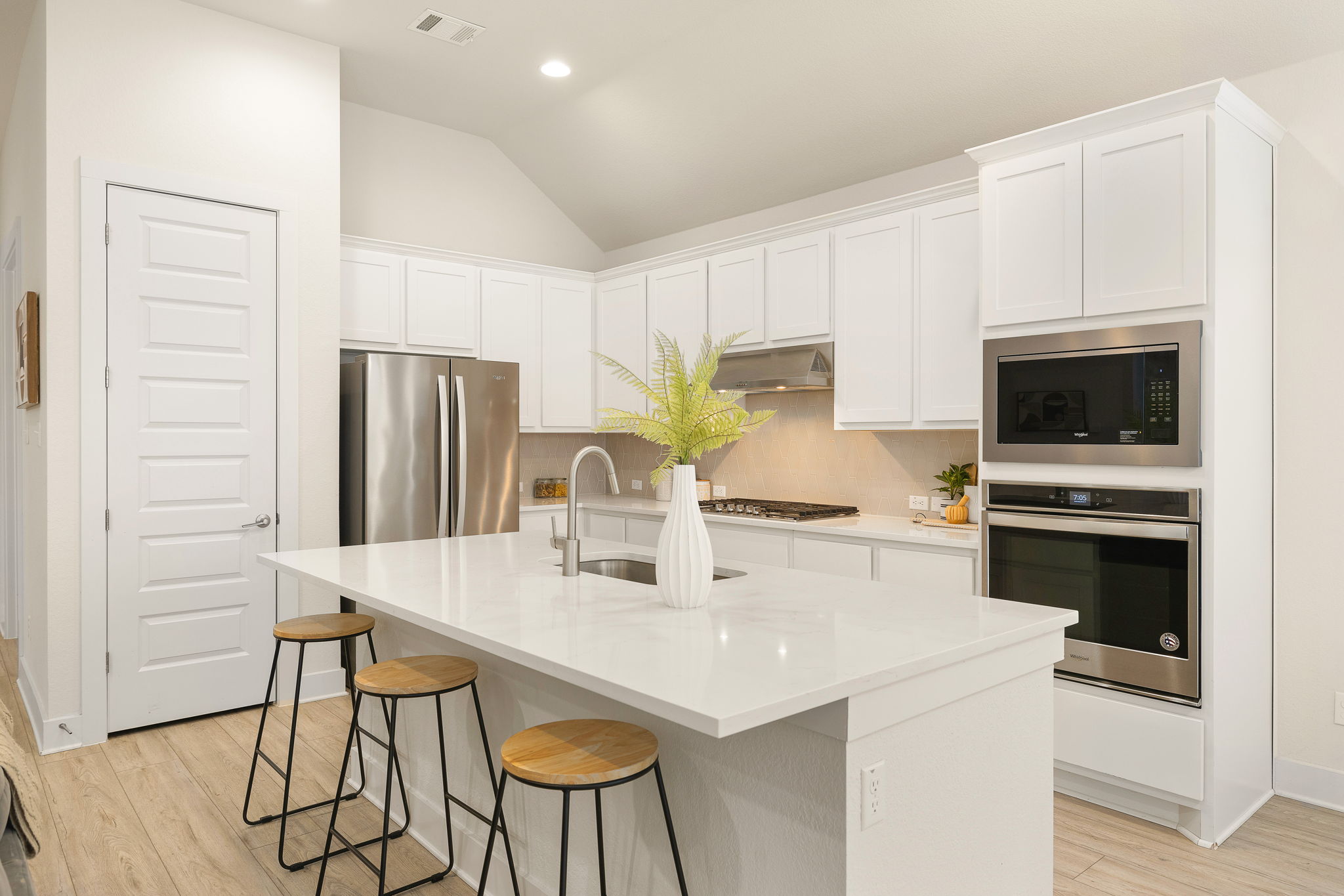20904 Carries Ranch Road Pflugerville, TX 78660 - Photo 14 of 33 a kitchen with appliances a sink and cabinets