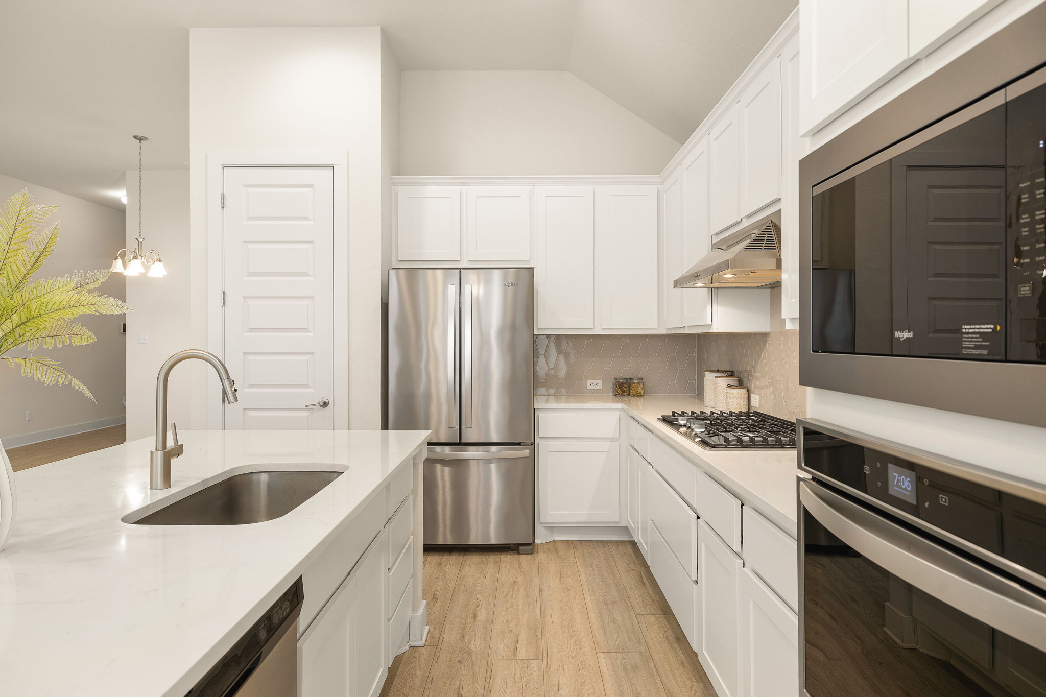 20904 Carries Ranch Road Pflugerville, TX 78660 - Photo 16 of 33 a kitchen with a sink stove and refrigerator