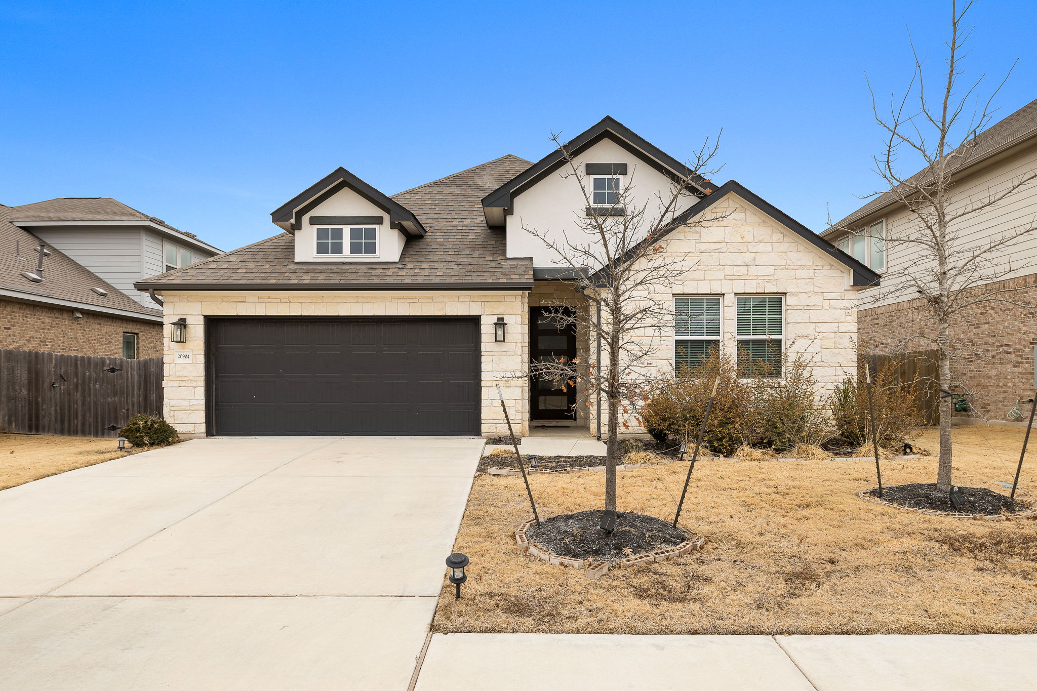 20904 Carries Ranch Road Pflugerville, TX 78660 - Photo 2 of 33 a front view of a house with a yard