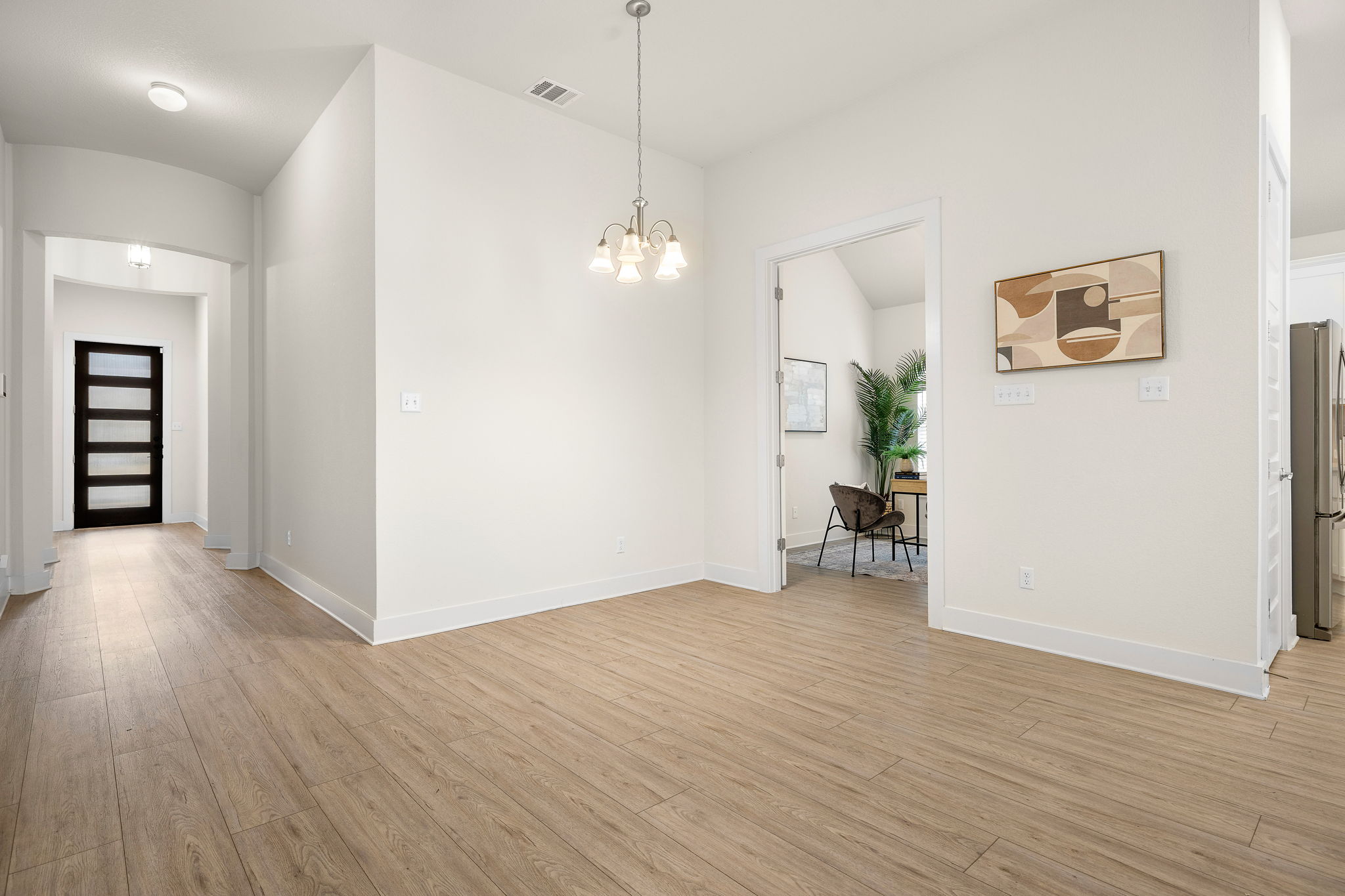 20904 Carries Ranch Road Pflugerville, TX 78660 - Photo 4 of 33 a view of empty room with wooden floor