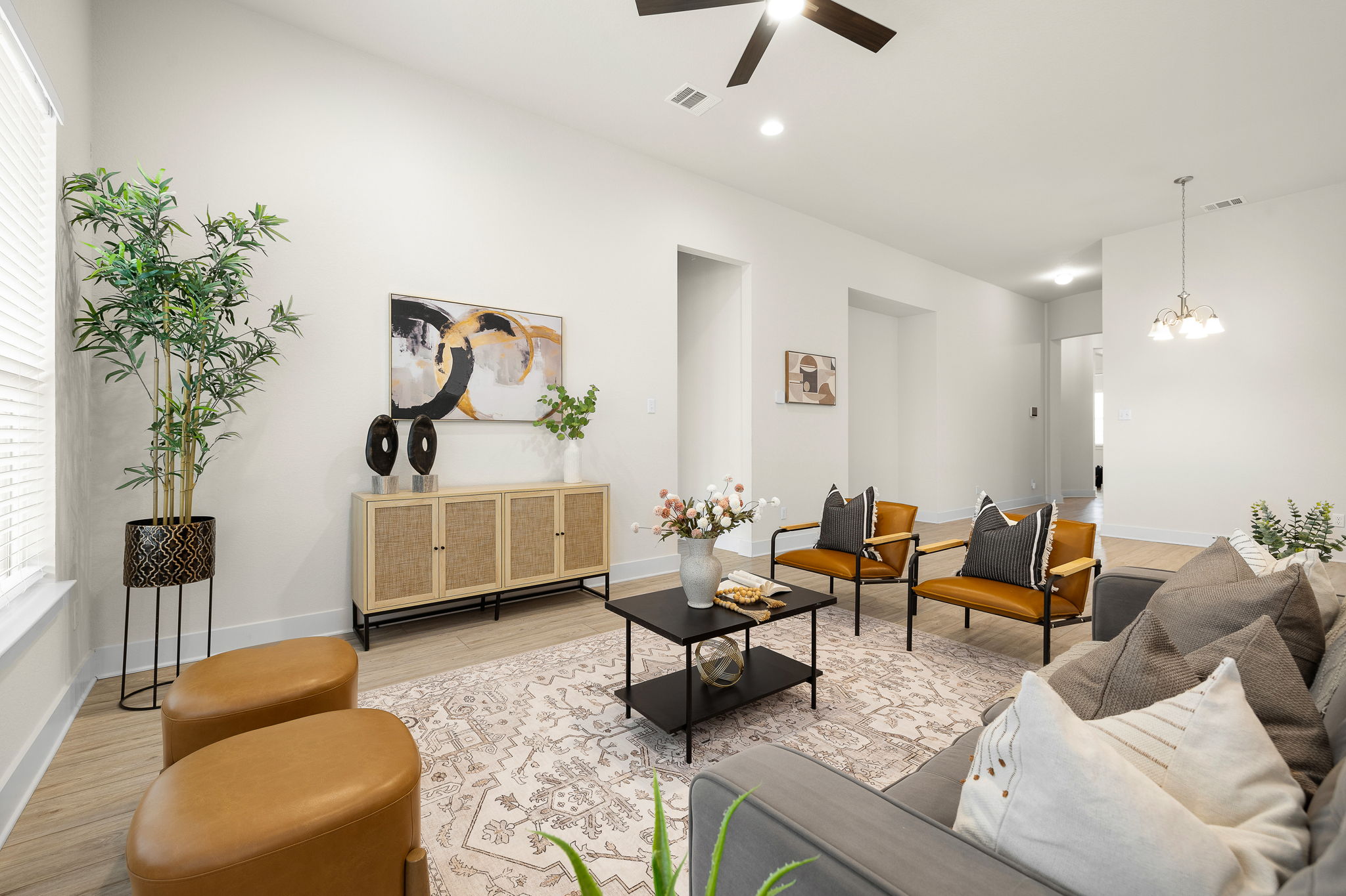 20904 Carries Ranch Road Pflugerville, TX 78660 - Photo 9 of 33 a living room with furniture and a potted plant