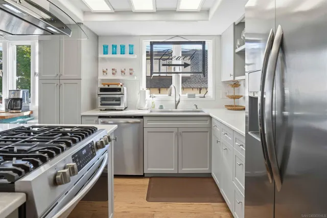 a kitchen with a stove and a refrigerator