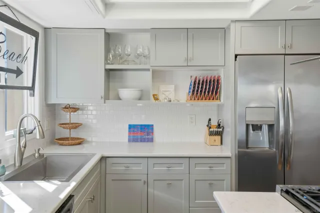 a kitchen with a sink and refrigerator