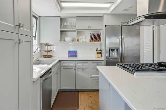 a kitchen with a sink stove and refrigerator