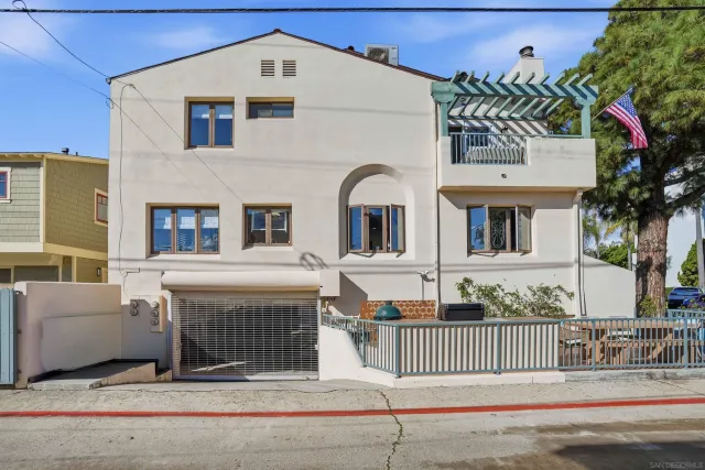 a front view of a house with a fence