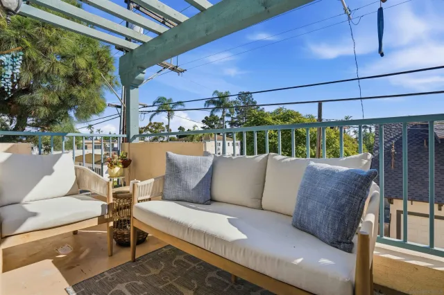 a outdoor living space with furniture and a fireplace