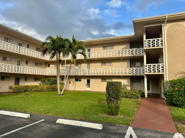 a view of a car park in front of a building