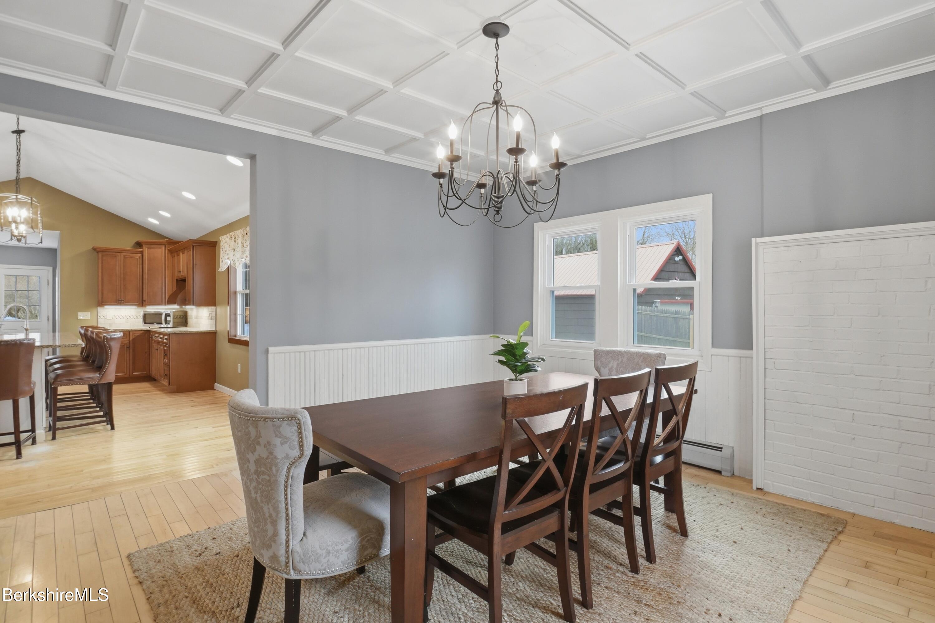 165 High Street Dalton, MA 01226 - Photo 13 of 38 a view of a dining room with furniture a chandelier and wooden floor