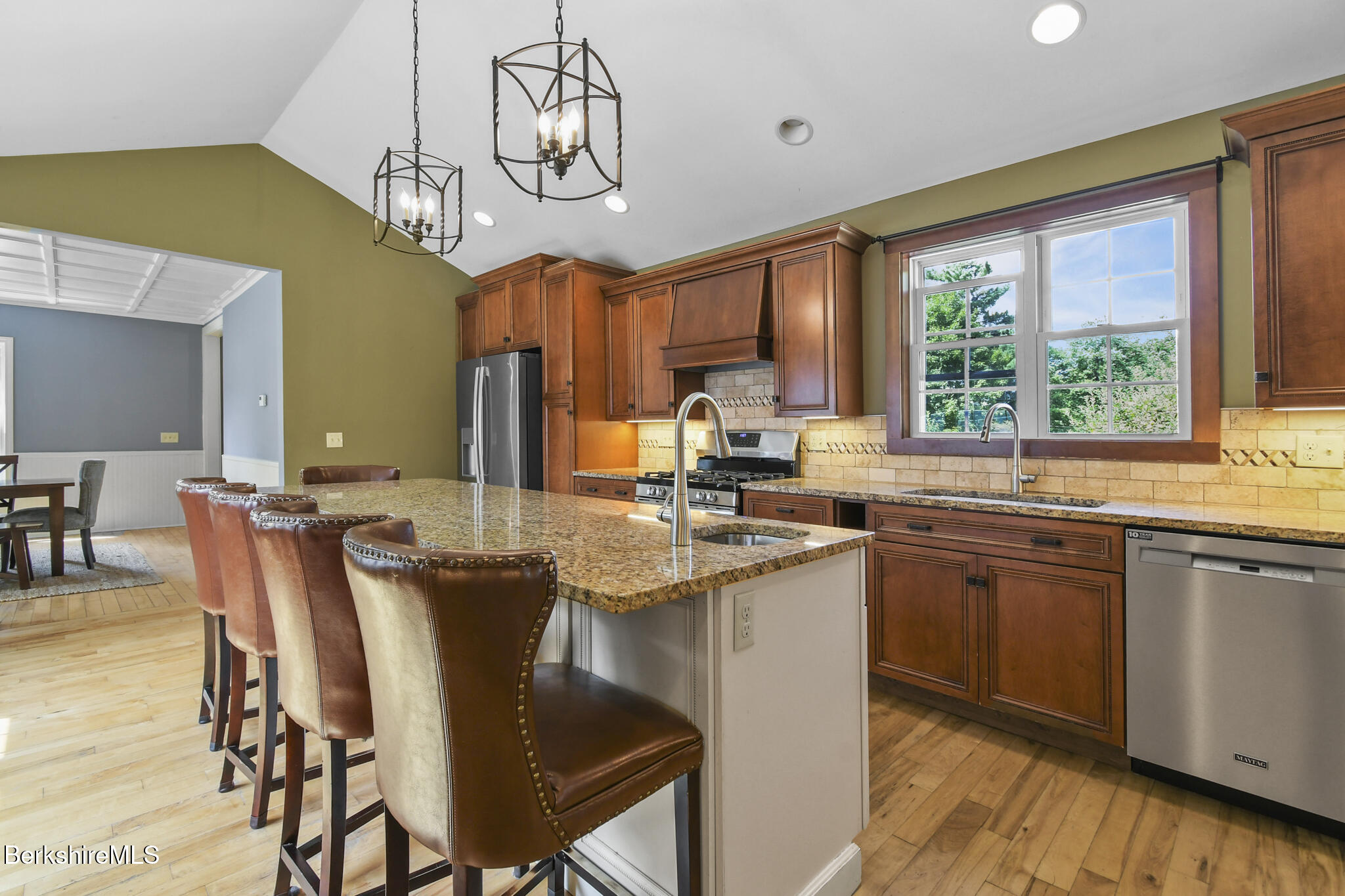165 High Street Dalton, MA 01226 - Photo 16 of 38 a kitchen with a table chairs sink and cabinets