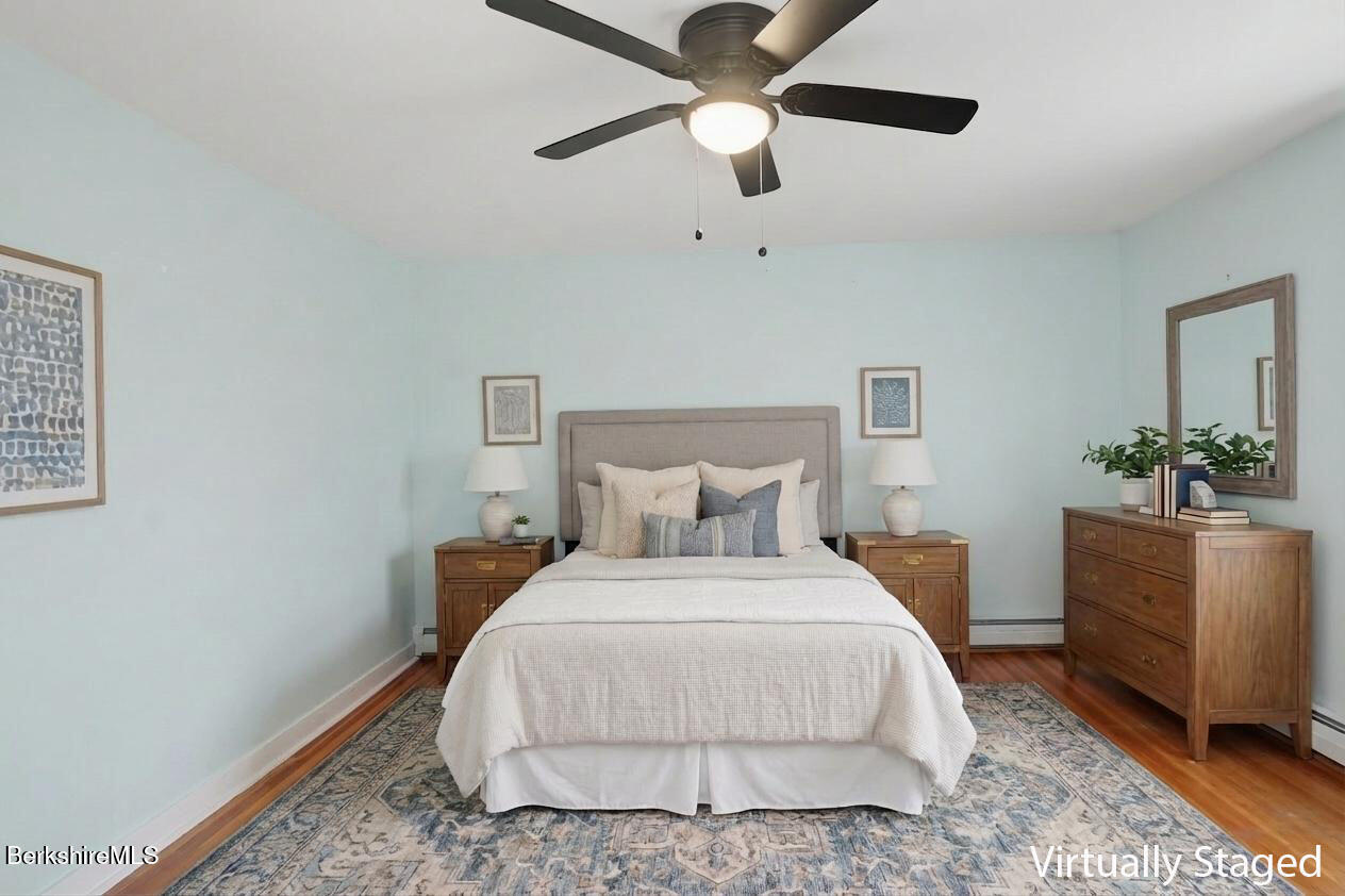 165 High Street Dalton, MA 01226 - Photo 19 of 38 a bedroom with a bed and a potted plant